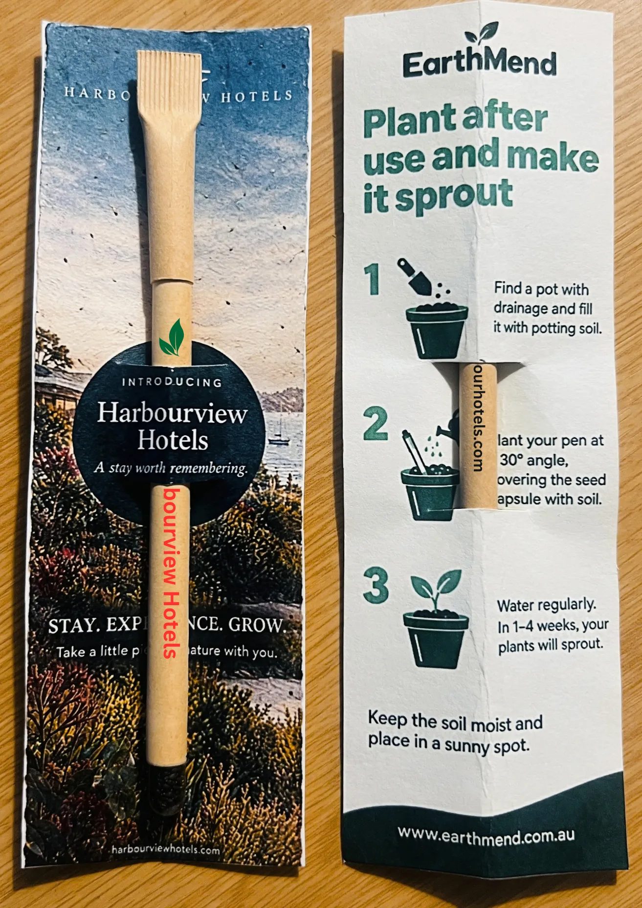 An EarthMend pen in a sample card sleeve branded for a fictional hotel company, beside EarthMend's own 'Plant after use' instructions card